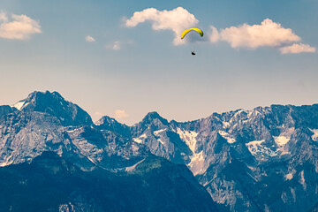 Alpine summer view with a paraglider at Mount Wank, Garmisch-Partenkirchen, Bavaria, Germany