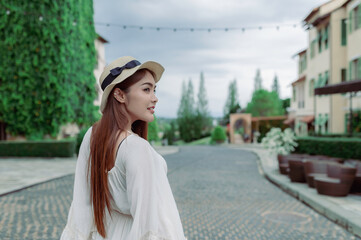 Asian woman traveling at the old town italy style,Alone travel,Lifestyle of single girl,View mountain with fog