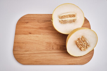 Slices of juicy melon on a light background. Organic summer fruits. The concept of food, health, nutrition
