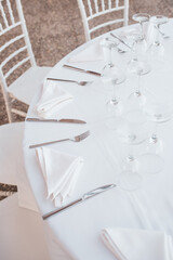 Served table with glasses at sunset. Romantic date in the restaurant.  