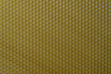 Background texture and pattern of section voshchina of wax honeycomb from a bee hive for filled...