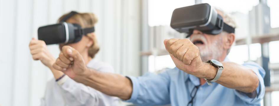 Happy senior couple, elderly family, caucasians mature, adult lover and retired man, woman wearing VR headset or visual reality goggles, gadget, play video game of simulator futuristic of technology