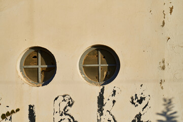 old wall with window and shutters