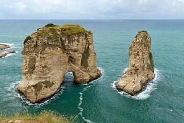 Naklejka premium Coast of Mediterranean sea in Beirut city. View of Pigeon Rocks. Lebanon.