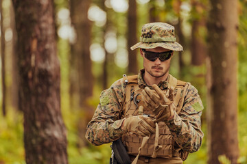 American marine corps special operations soldier preparing tactical and commpunication gear for action battle closeup