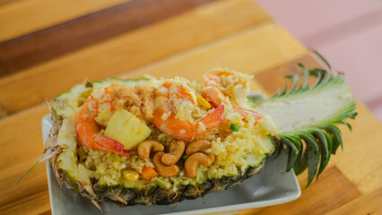 blackberry was cut in half to cover the food It consists of rice and seafood such as shrimp