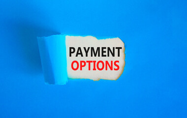 Payment options symbol. Concept words Payment options on beautiful white paper. Beautiful blue background. Business payment options concept. Copy space.