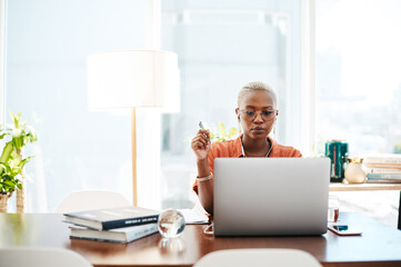 The most effective way to do it is simply to do it. Shot of a young businesswoman wearing earphones...