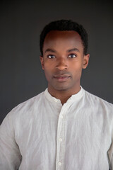 Obraz premium african man portrait studio head shot white shirt