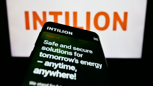 Stuttgart, Germany - 07-15-2023: Smartphone with website of German energy storange company INTILION AG on screen in front of business logo. Focus on top-left of phone display.