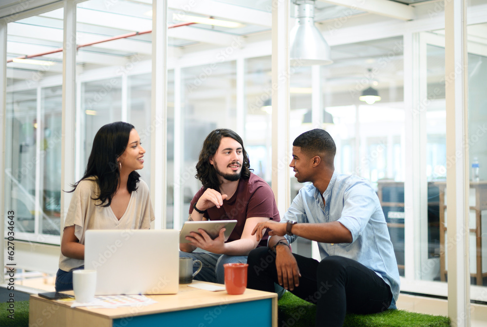 Poster working together to exceed the expectations of everyone. shot of a group of businesspeople using a d