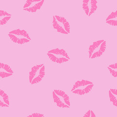 Kiss prints. Female sexy lips on pink background.