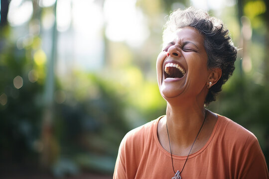 A person participating in a laughter yoga session to lift their spirits.
