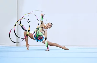 Foto op Plexiglas Gymnastics woman, ribbon and floor in portrait, competition or sport for fitness, performance or studio. Gymnast, athlete girl and professional dancer with balance, exercise or contest for creativity © Ramba/peopleimages.com