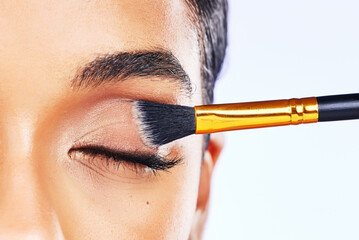 Beauty, makeup and brush with eye of woman in studio for cosmetics, product and eyeshadow. Salon,...