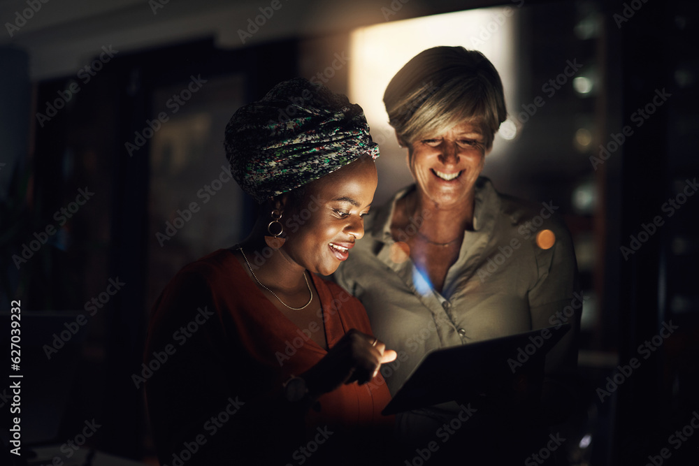 Aufkleber optimising their time with technology. shot of two businesswomen using a digital tablet together in 