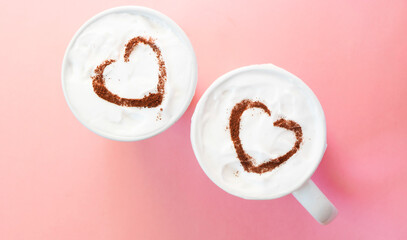 Hearts shapes on Two cups of coffee top view. Valentine's day greeting. Romantic atmosphere 