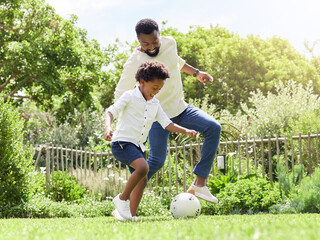 Soccer, happy dad and kid on a garden with exercise, sport learning and goal kick together. Lawn,...