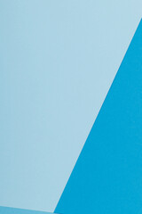 Multicolor background from a paper of different shades of blue. Geometric backdrop.