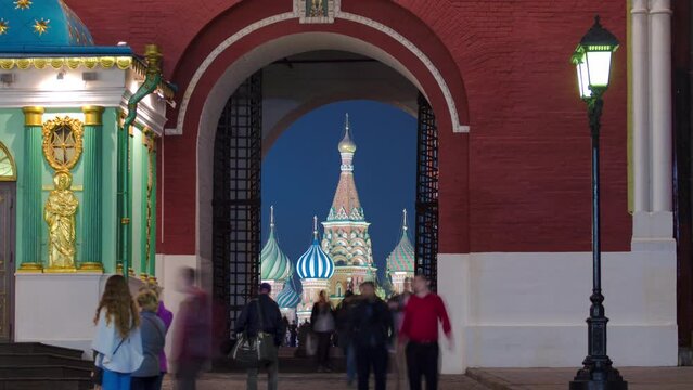 View to St Basil's Church through Iberian Gate or Resurrection Gate of historic Kitai-gorod Wall in Moscow, Russia timelapse. The Gate between the north-western end of Red Square and Manege Square