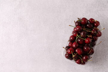 red cherries on wooden background