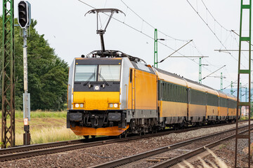 Regiojet Bombardier Traxx. International and regional railway transportation. Passenger freight train set at station. Public transport.