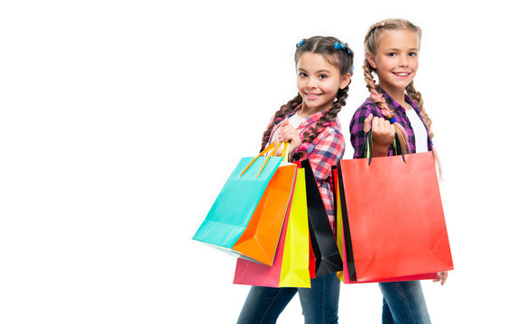 teen children go shopping. girls with shopping bags. shopping sale and discount. teen children girls with bags. Exploring boutiques and department stores. copy space