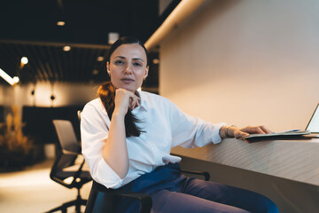 Serious businesswoman working in modern workspace