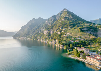 Fototapeta premium Marone, Lake Iseo. Aerial panoramic sunset view of Marone town surrounded by mountains and located in Iseo Lake, Brescia, Lombardy, Italy