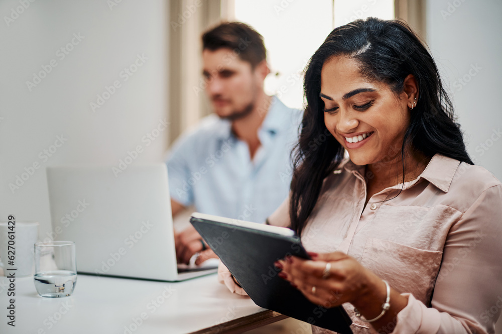 Poster facilitating a meeting with awesome functionality. shot of a young businesswoman using a digital tab