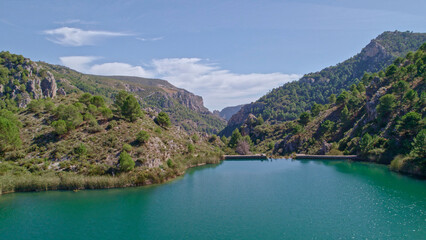 Fototapeta na wymiar Reservoir at full capacity. Aerial view of a water reserve for human use. Water reserves for human consumption. Andalusia. Spain.