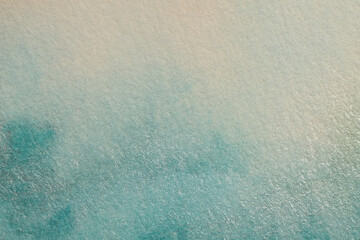 Beige, blue grain watercolor smoke flow stain blot on wet paper texture background.