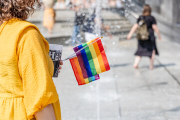 Celebration of pride month, Colourful rainbow flag hanging waving in the air on white grey background, Symbol of Gay, Lesbian, Bisexual and Transgender, LGBTQ community, Worldwide social movements.