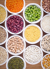 Mixed dried legumes and cereals isolated on white background, top view