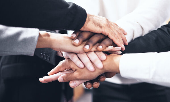Business people, meeting and hands together for teamwork, unity or collaboration at the office. Hand of group touching for team agreement, motivation or support in trust, solidarity or integration