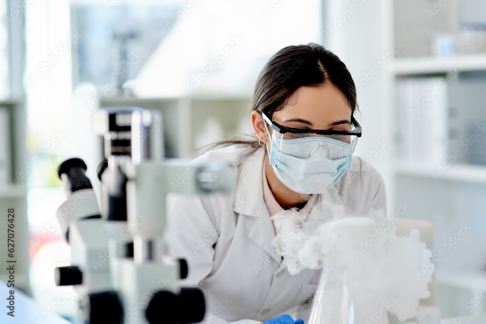 Aufkleber The world of science is so intriguing. Shot of a young scientist doing an experiment in a lab.