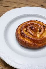 Delicious flavored pastries on a wooden table.  Close up