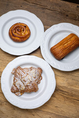 Delicious flavored pastries on a wooden table.  Close up