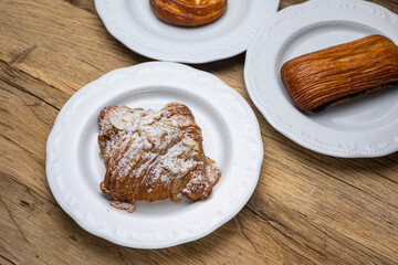 Delicious flavored pastries on a wooden table.  Close up