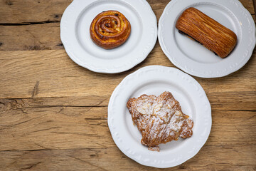 Delicious flavored pastries on a wooden table.  Close up