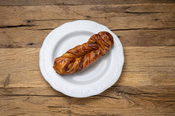 Delicious flavored pastries on a wooden table.  Close up