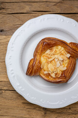 Delicious flavored pastries on a wooden table.  Close up