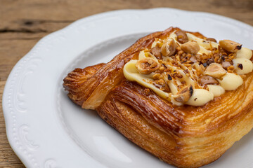 Delicious flavored pastries on a wooden table.  Close up