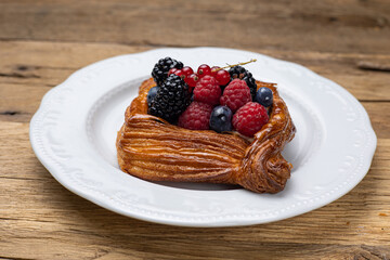 Delicious flavored pastries on a wooden table.  Close up