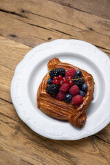 Delicious flavored pastries on a wooden table.  Close up