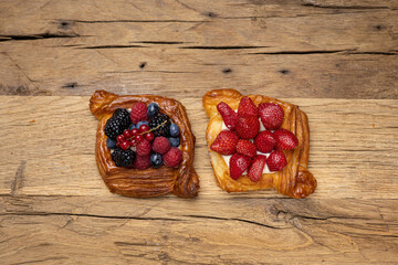 Delicious flavored pastries on a wooden table.  Close up