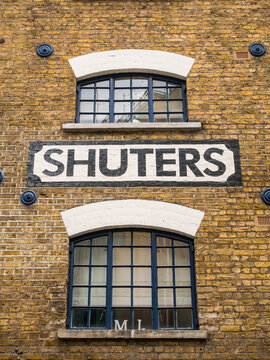 London, UK, July 27th, 2023:Shuters Wharf, Bermondsey. Old buildings next to the River Thames were originally constructed as warehouses or wharfs in the docks. Now covered to flats and offices.