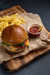 A delicious hamburger on the table.  Close up