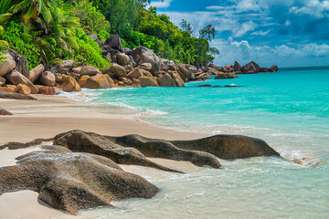Amazing picturesque paradise beach with granite rocks and white sand, turquoise water on a tropical...