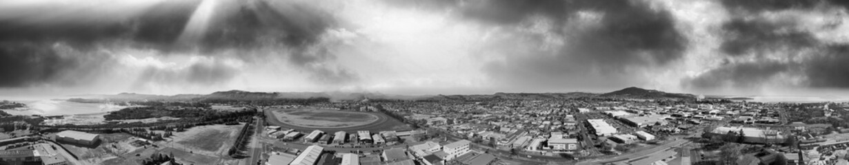 Panoramic aerial view of Rotorua landscape and geysers smoke, New Zealand from drone